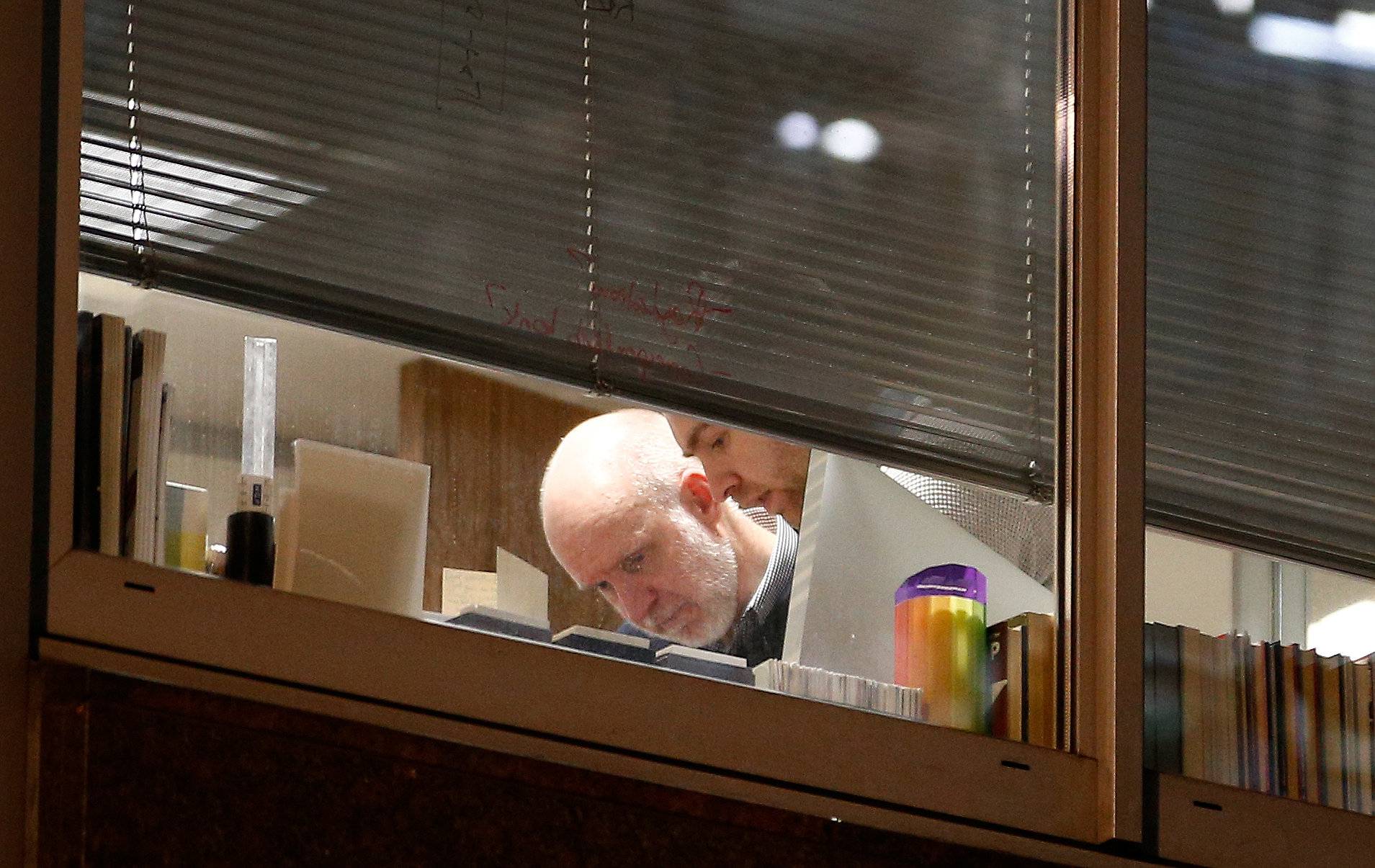 People are seen are seen inside the building which houses the offices of Cambridge Analytica as investigators from Britain's Information Commissioners Office entered, following the granting of a search warrant by a High Court judge, in London