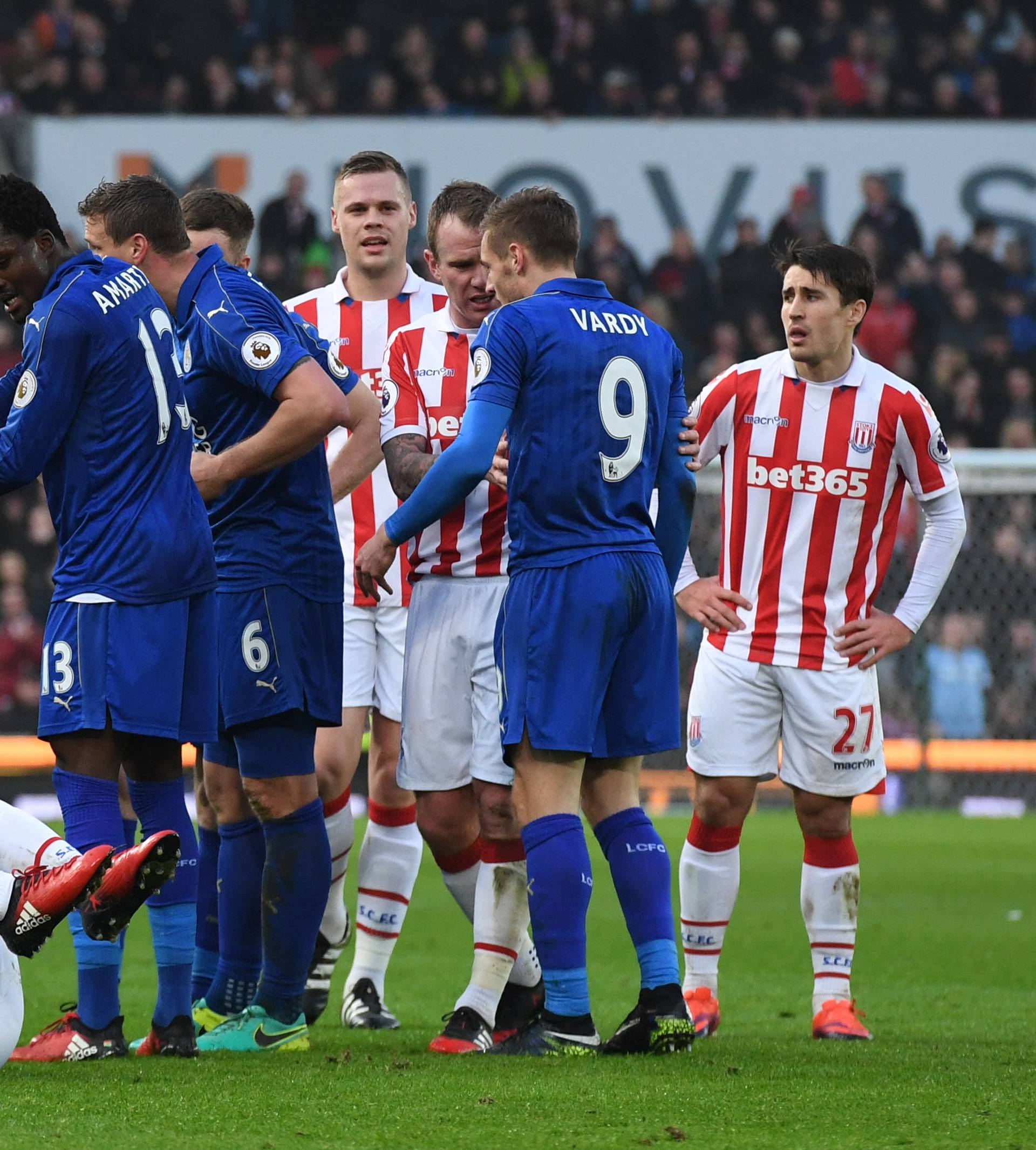 Stoke City's Mame Biram Diouf is down injured after being fouled by Leicester City's Jamie Vardy