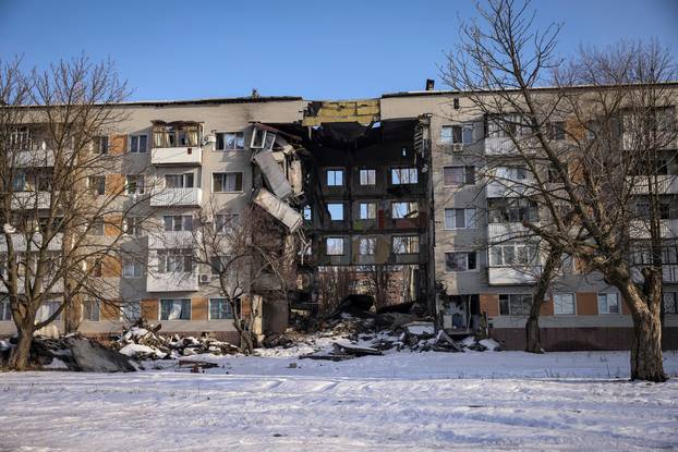 A general view shows an apartment building damaged by a Russian military strike in the frontline city of Bakhmut