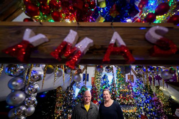 A family breaks their own world record for the most Christmas trees in their home