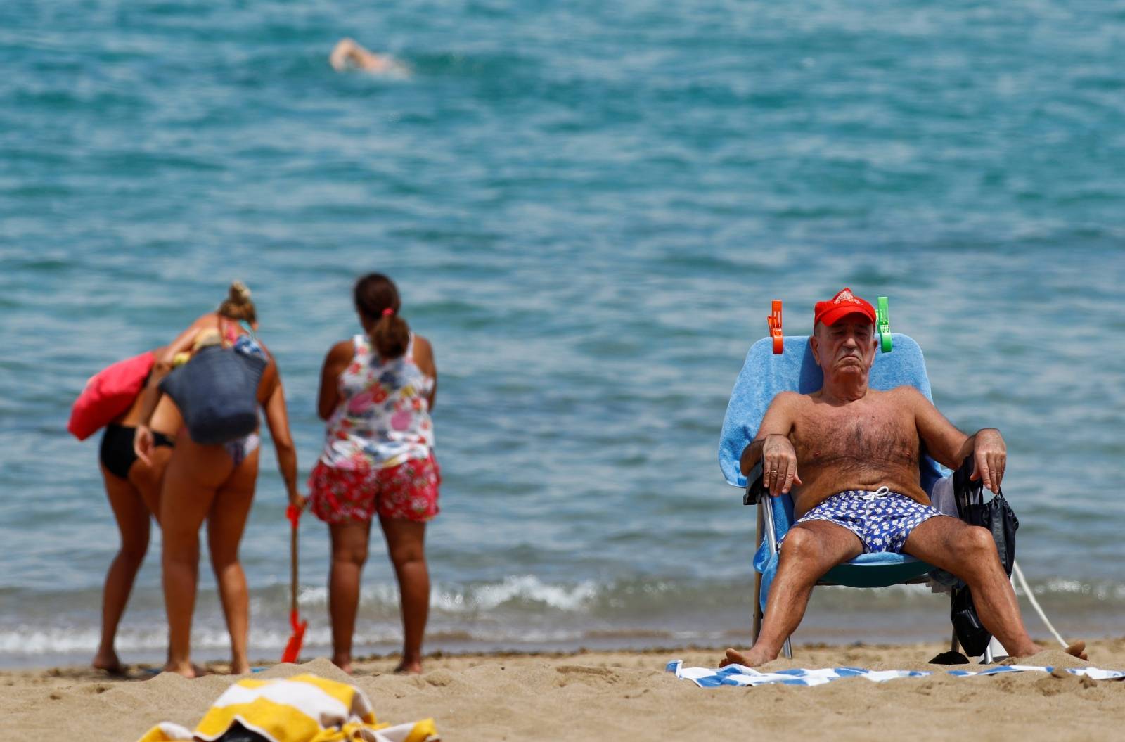 A man sunbathes on the Las Canteras beach as some Spanish provinces are allowed to ease lockdown restrictions during phase two, on the island of Gran Canaria