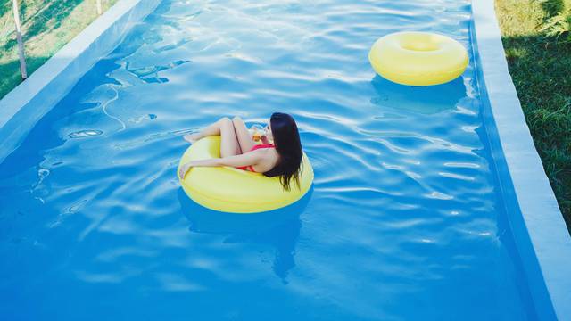 Attractive Woman on Water Float