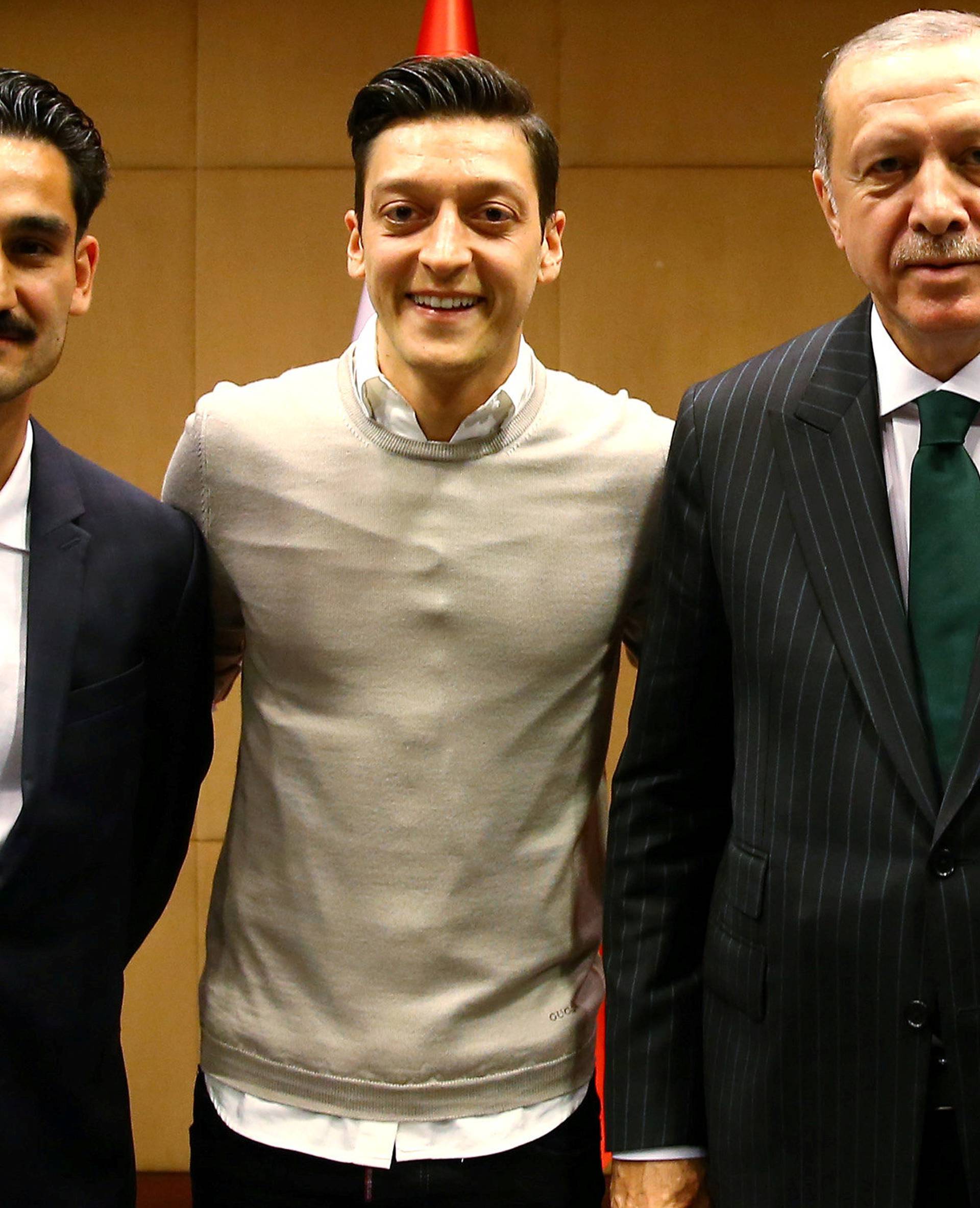 FILE PHOTO: Turkish President Erdogan meets with Premier League soccer players Gundogan of Manchester City, Ozil of Arsenal and Tosun of Everton in London