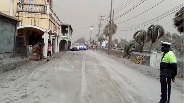 Ash covers roads a day after the La Soufriere volcano erupted after decades of inactivity in St Vincent and the Grenadines