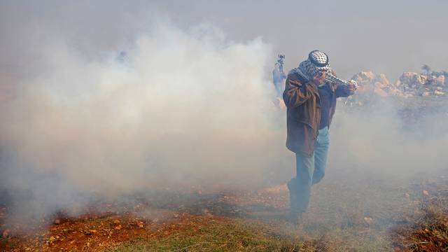 Palestinians protest against Jewish settlements in the Israeli-occupied West Bank