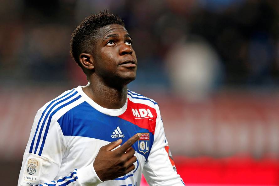 Olympique Lyon's Umtiti celebrates after scoring a goal against Troyes during their French Ligue 1 soccer match at the Stade de l'Aube stadium in Troyes