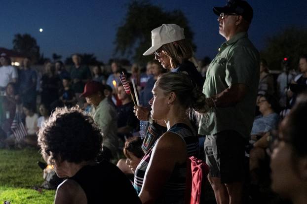 Catholics from across the Phoenix area gather to pray for Charlie Kirk, who was shot and killed in Utah, at Desert Horizon Park in Scottsdale