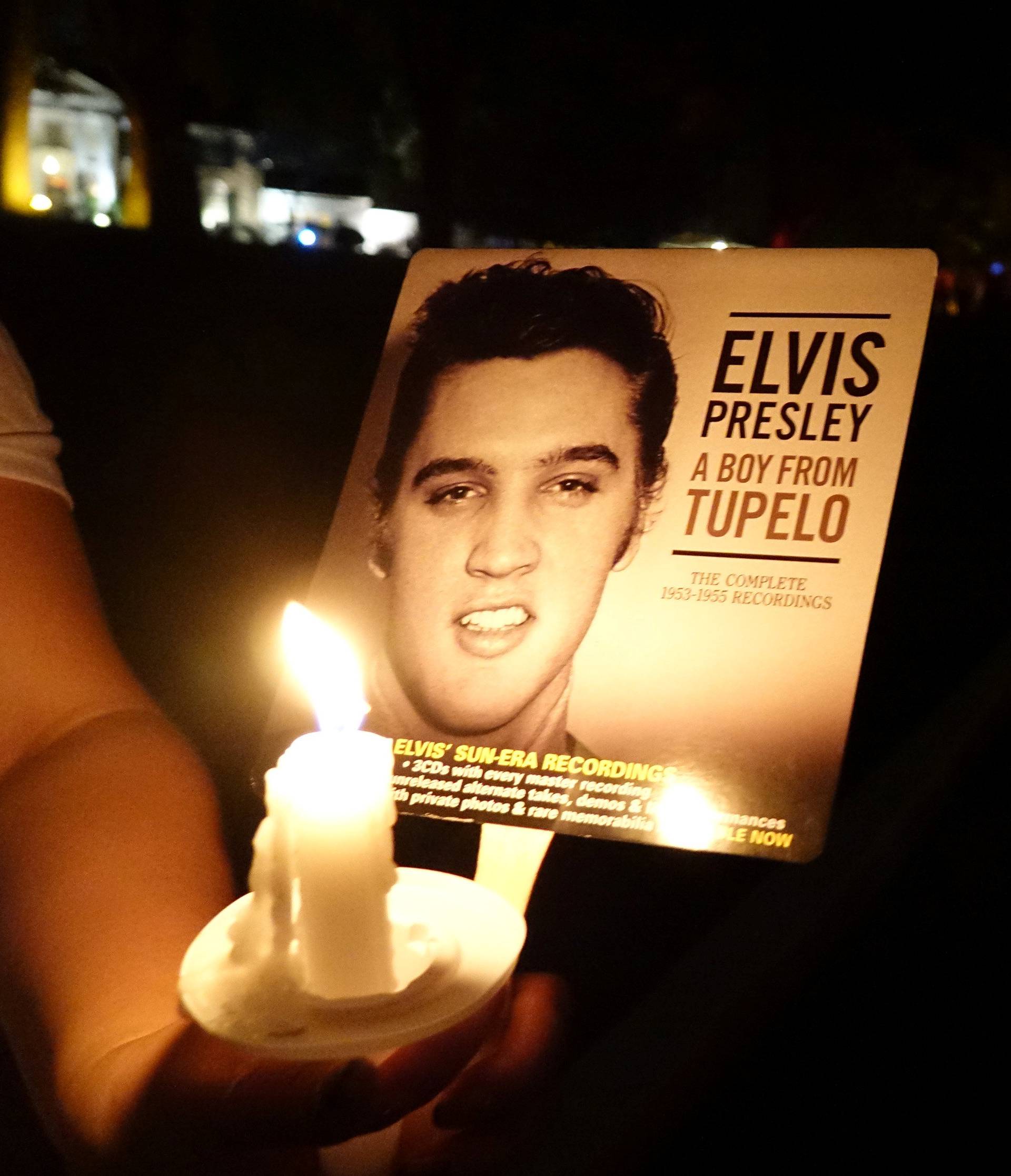 Mourners gather to commemorate the 40th anniversary of the death of singer Elvis Presley in Memphis