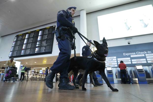 Policemen patrol in the Zaventem airport prior to a ceremony commemorating the first anniversary of twin attacks at Brussels airport and a metro train in Brussels