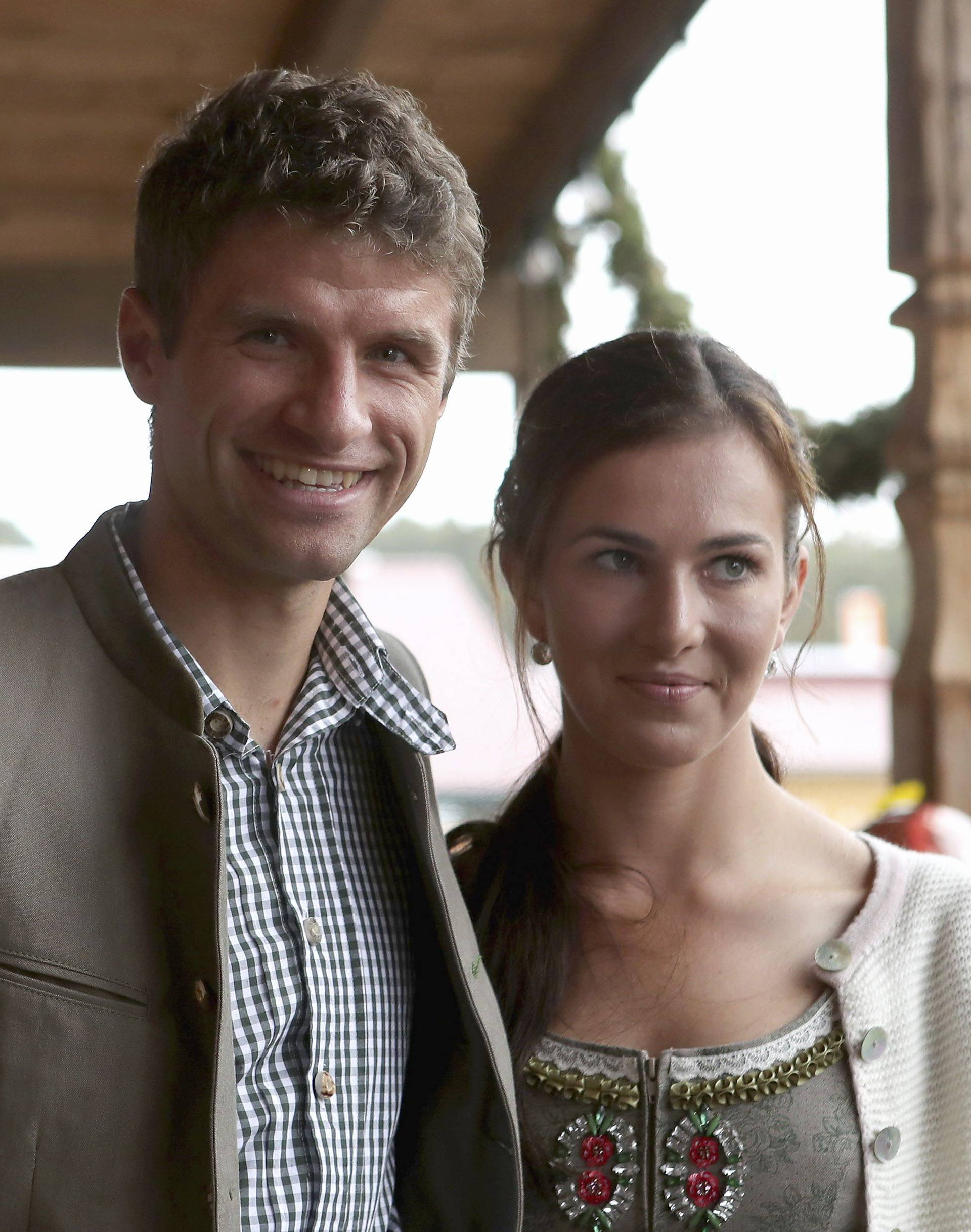 Mueller of FC Bayern Muenchen and his wife Lisa pose during their visit at the Oktoberfest in Munich