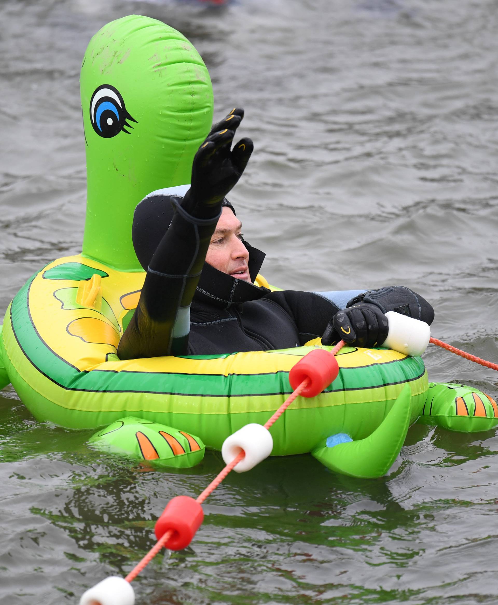 A swimmer wearing a costume bathes in the 3 degrees Celsius water of the river Danube in Neuburg an der Donau