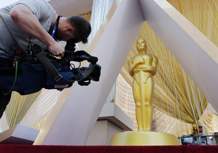 A cameraman films an Oscar statue on the red carpet as Oscars preparations continue for the 92nd Academy Awards in Hollywood