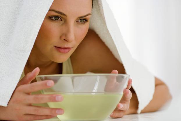 Woman with a sinus therapy bowl