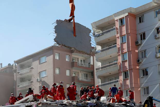 Rescue workers search for earthquake survivors in Izmir