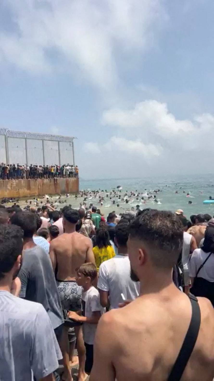 Migrants cross border into Spain's Ceuta, overwhelming police, Guardia Civil says