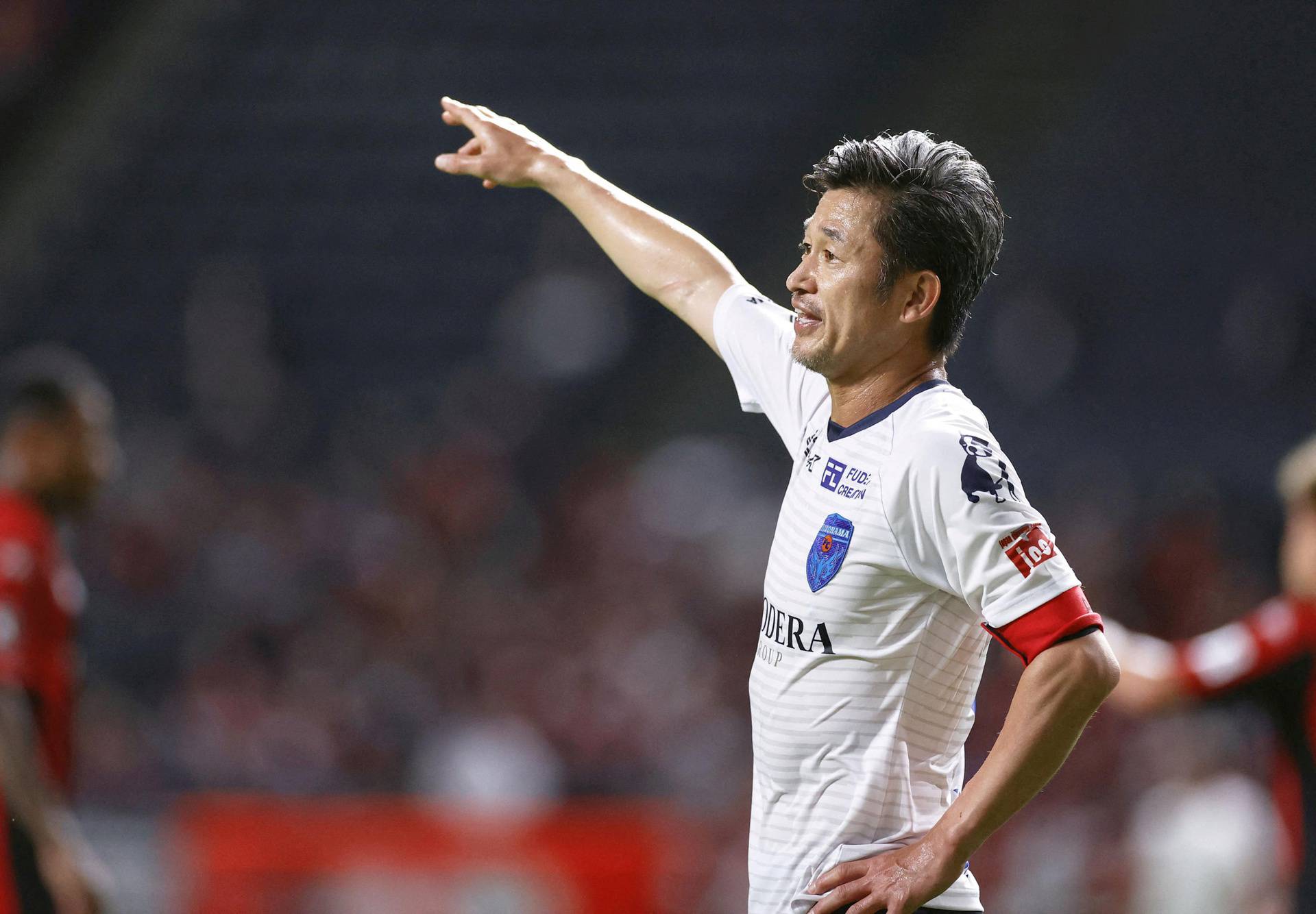 FILE PHOTO: Yokohama FC's Japanese striker Kazuyoshi Miura gestures during J. League YBC Levain Cup soccer match against Hokkaido Consadole Sapporo in Sapporo, Japan