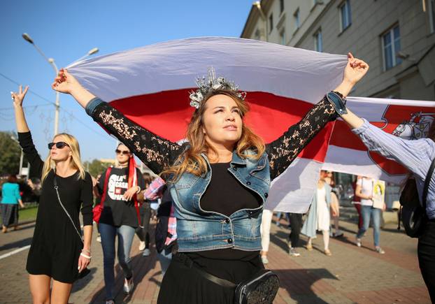 Belarusian opposition supporters hold a rally in Minsk