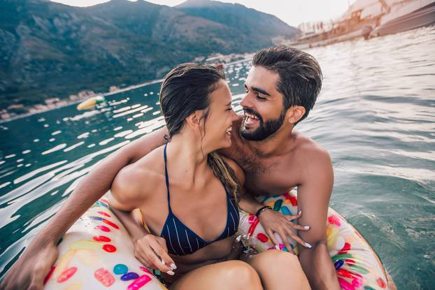 Happy couple resting at sea resort, having fun.