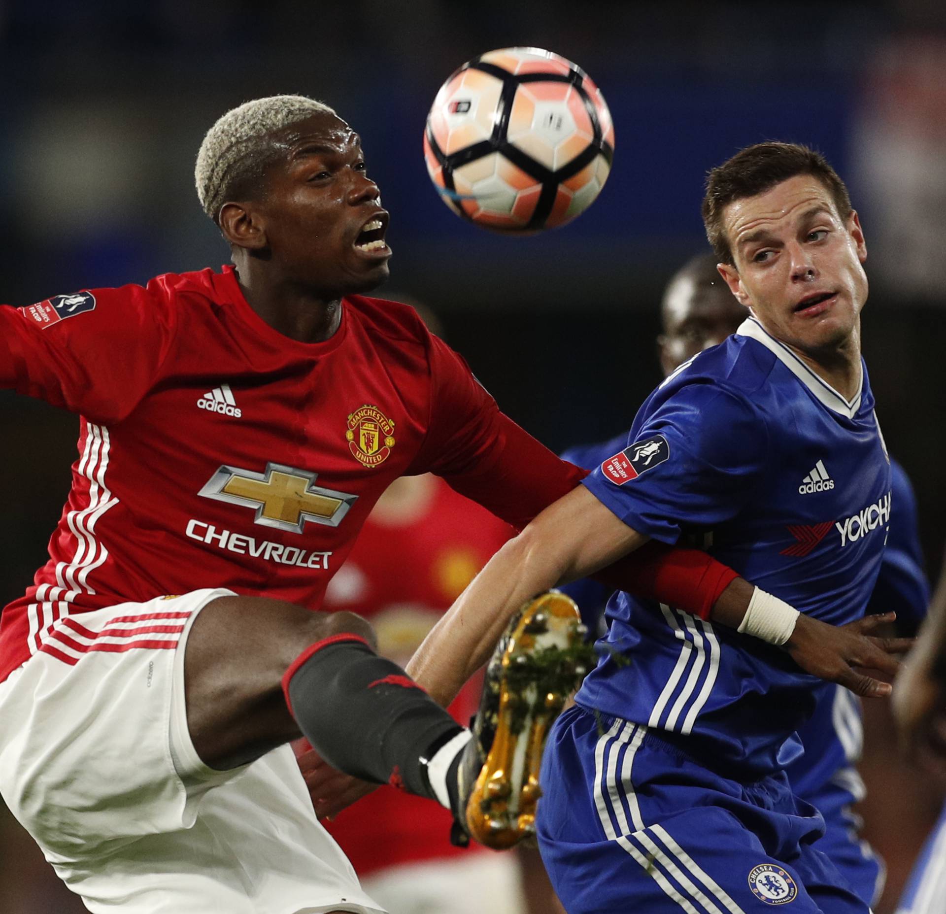 Manchester United's Paul Pogba in action with Chelsea's Cesar Azpilicueta