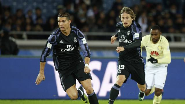 Real Madrid's Cristiano Ronaldo in action with Luka Modric