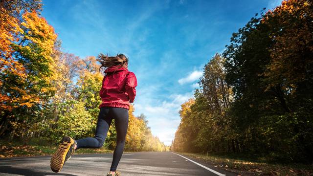 Lady runs on the road