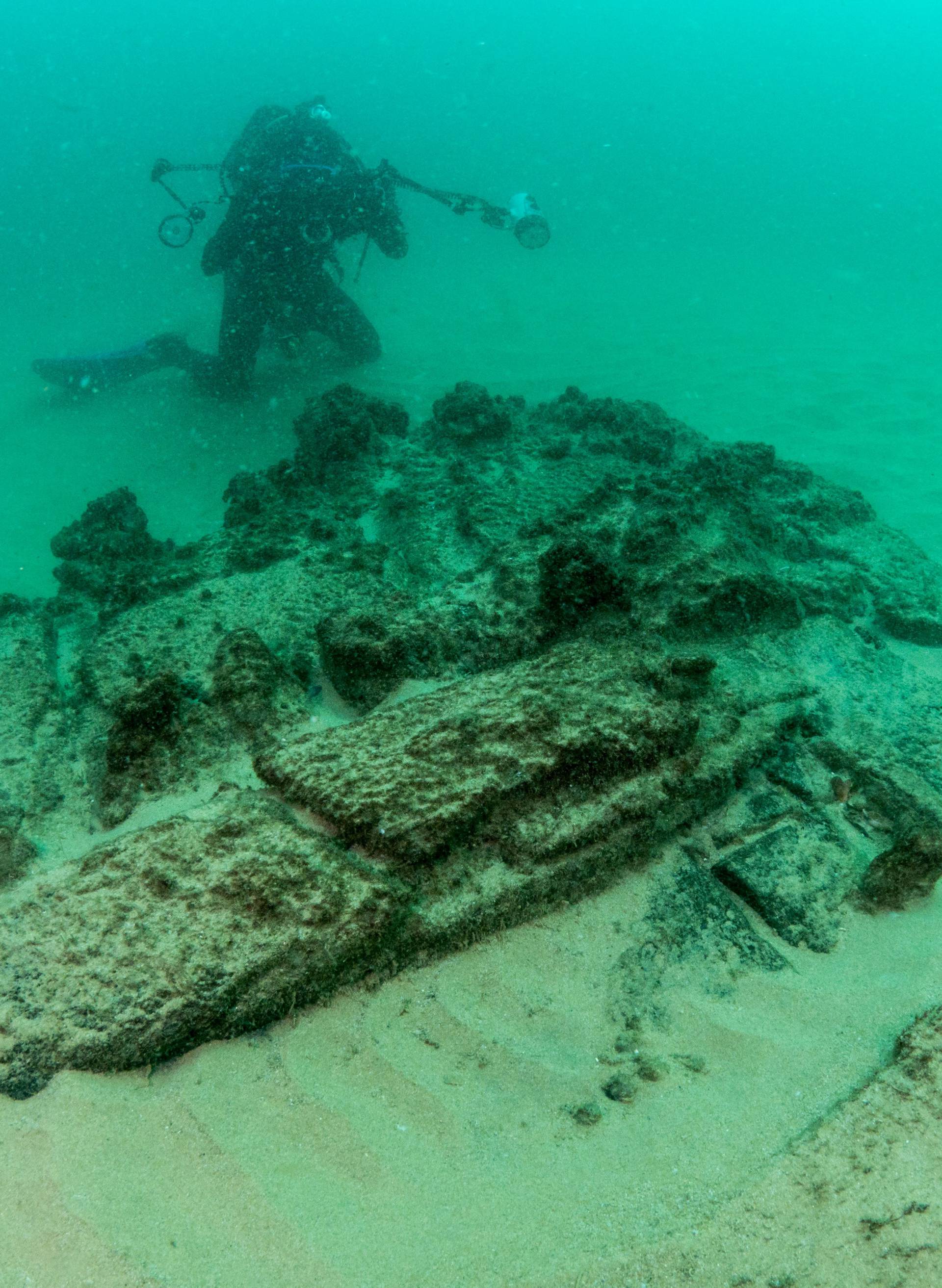 Divers are seen during the discovery of a centuries-old shipwreck, in Cascais