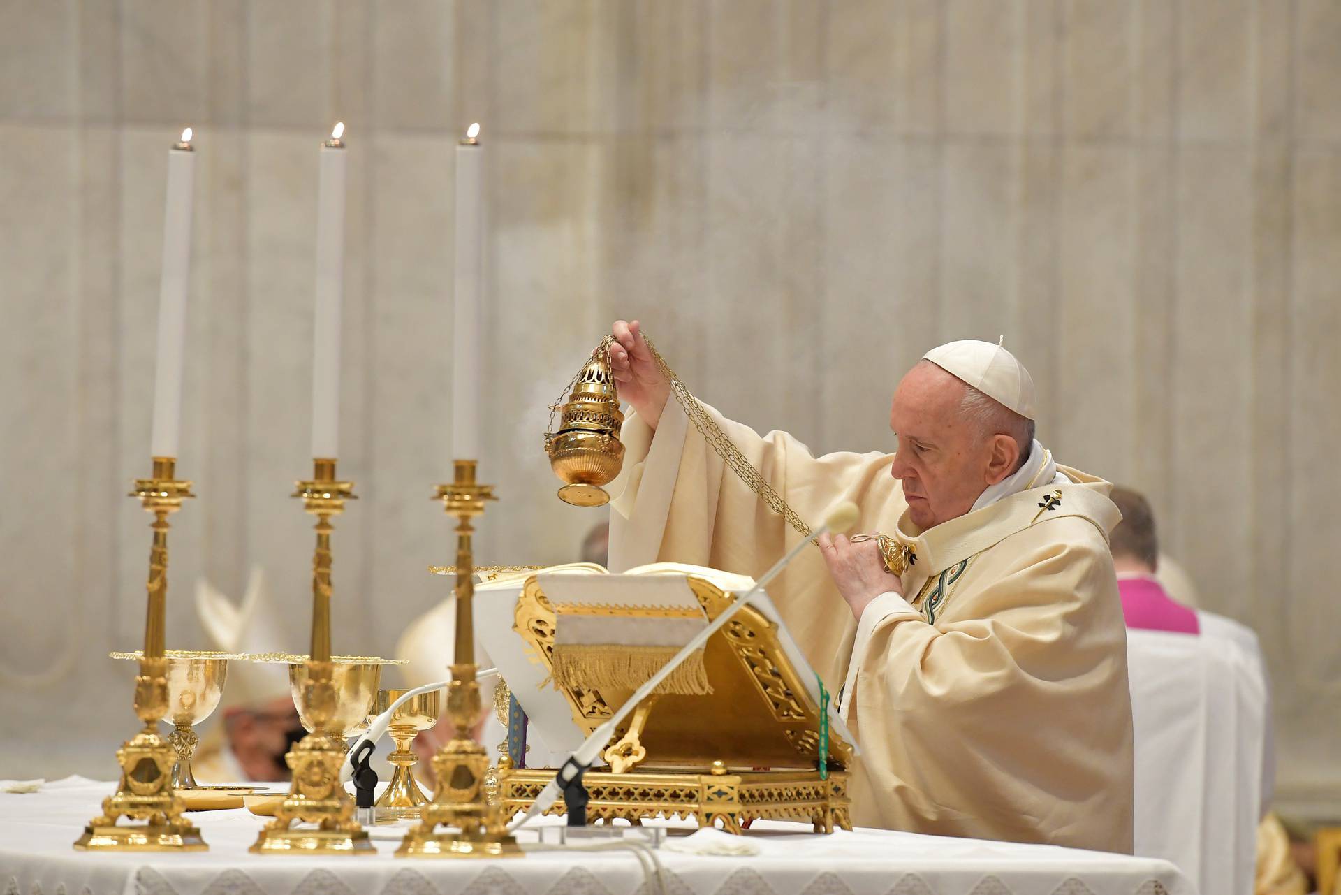 Pope Francis celebrates the Eucharist during Easter Sunday Mass at St. Peter's Basilica at the Vatican