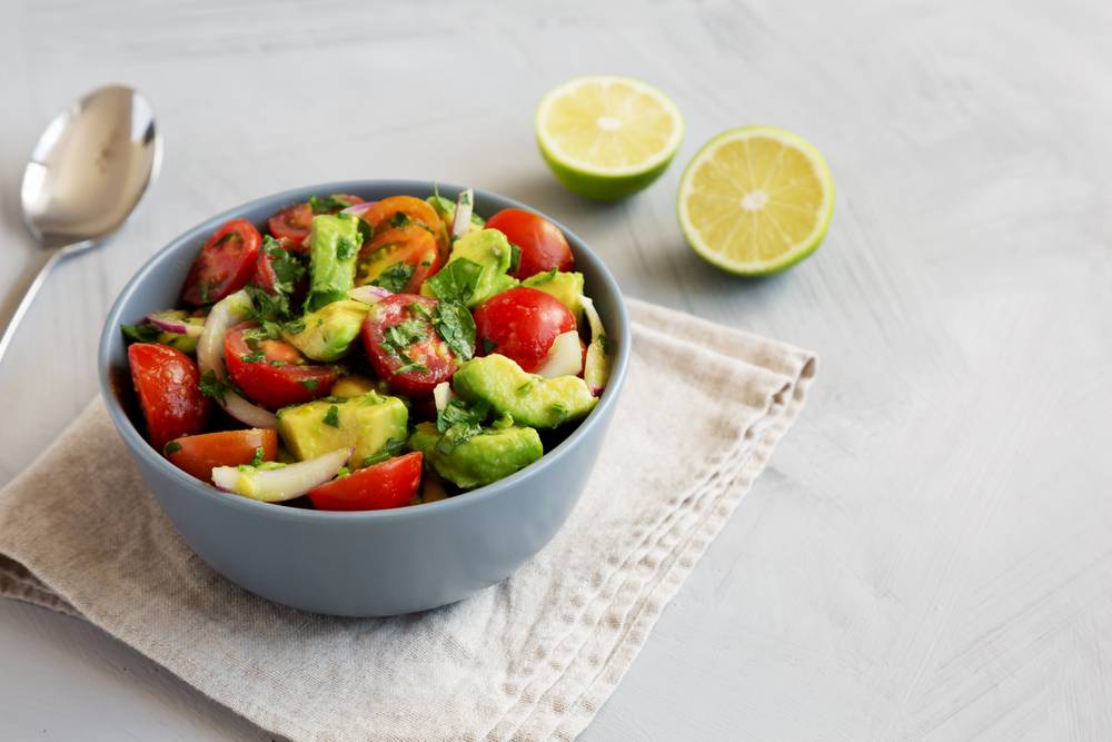 Homemade,Avocado,And,Tomato,Salad,In,A,Bowl,,Side,View.