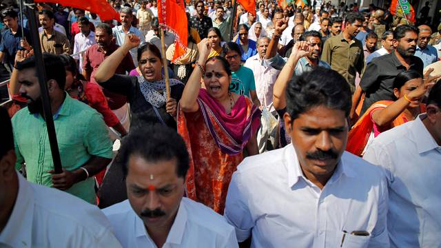 Supporters of BJP and Hindu nationalist organisation RSS attend a protest rally during a strike against the state government for allowing two women to defy an ancient ban and enter the Sabarimala temple, in Kochi