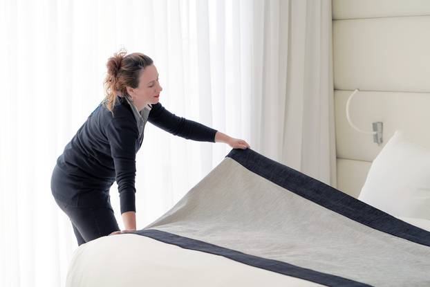 Maid Making Bed