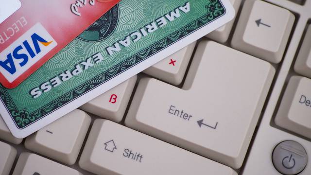 Amex and Visa credit cards on keyboard