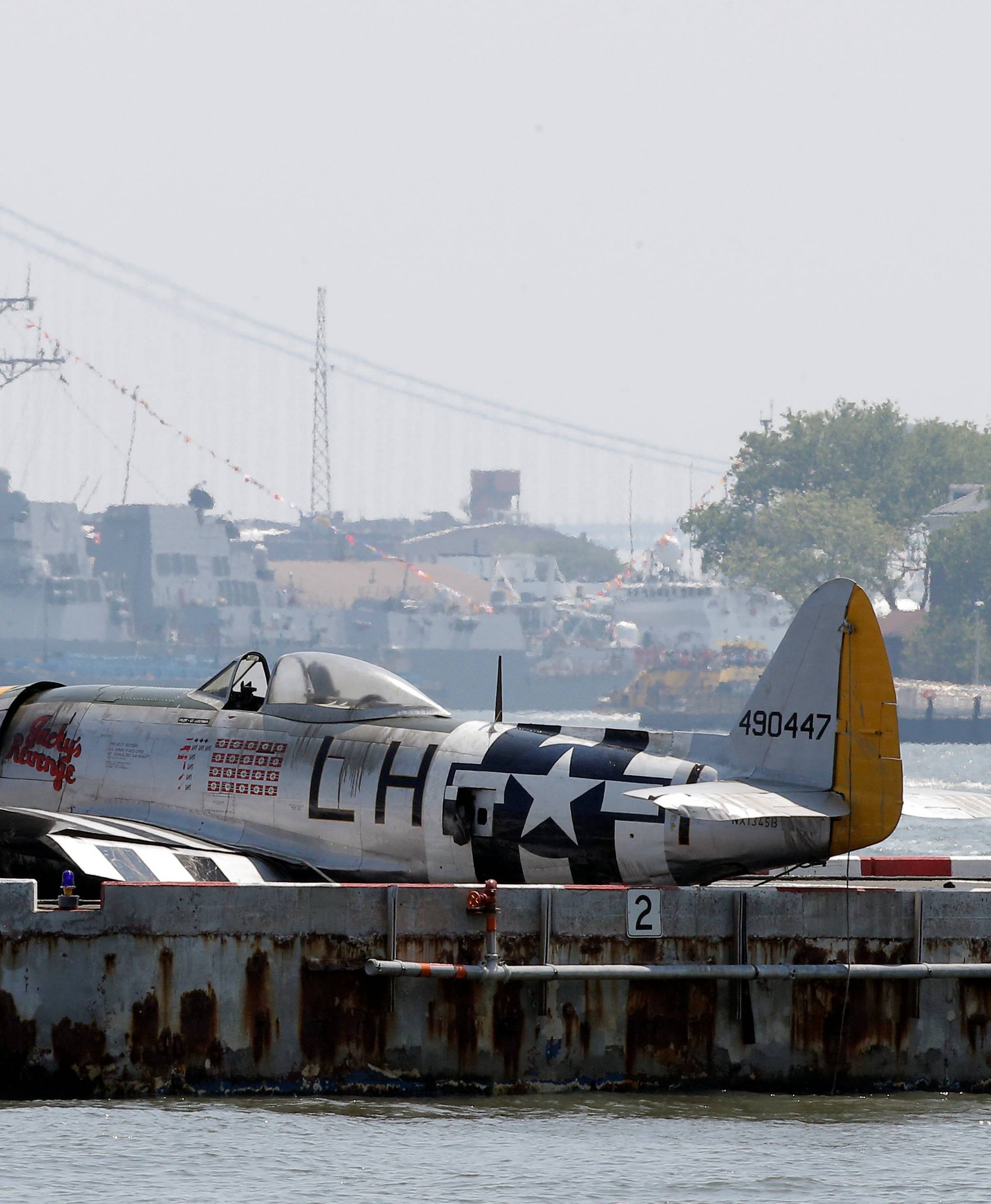 The wreckage of a vintage P-47 Thunderbolt airplane that crashed in the Hudson River sits on a barge in New York 