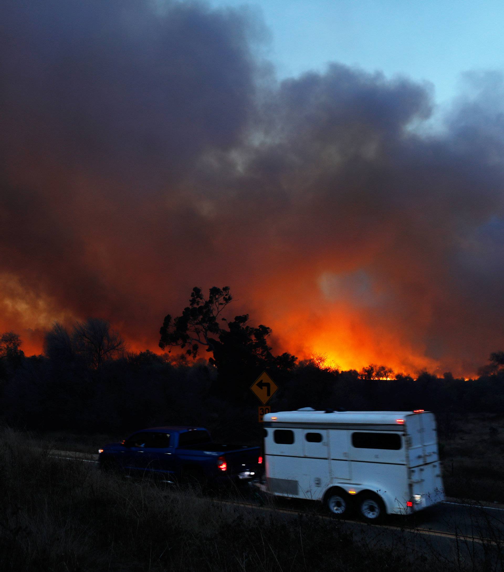 The Lilac Fire a fast moving wildfire continues to burn in Bonsall California