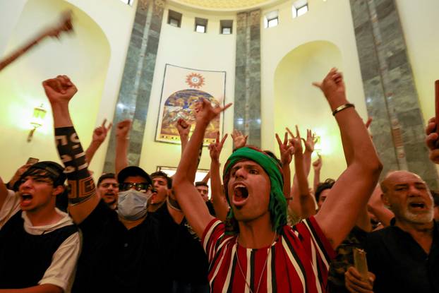 Supporters of Iraqi populist leader Moqtada al-Sadr protest at the Green Zone, in Baghdad