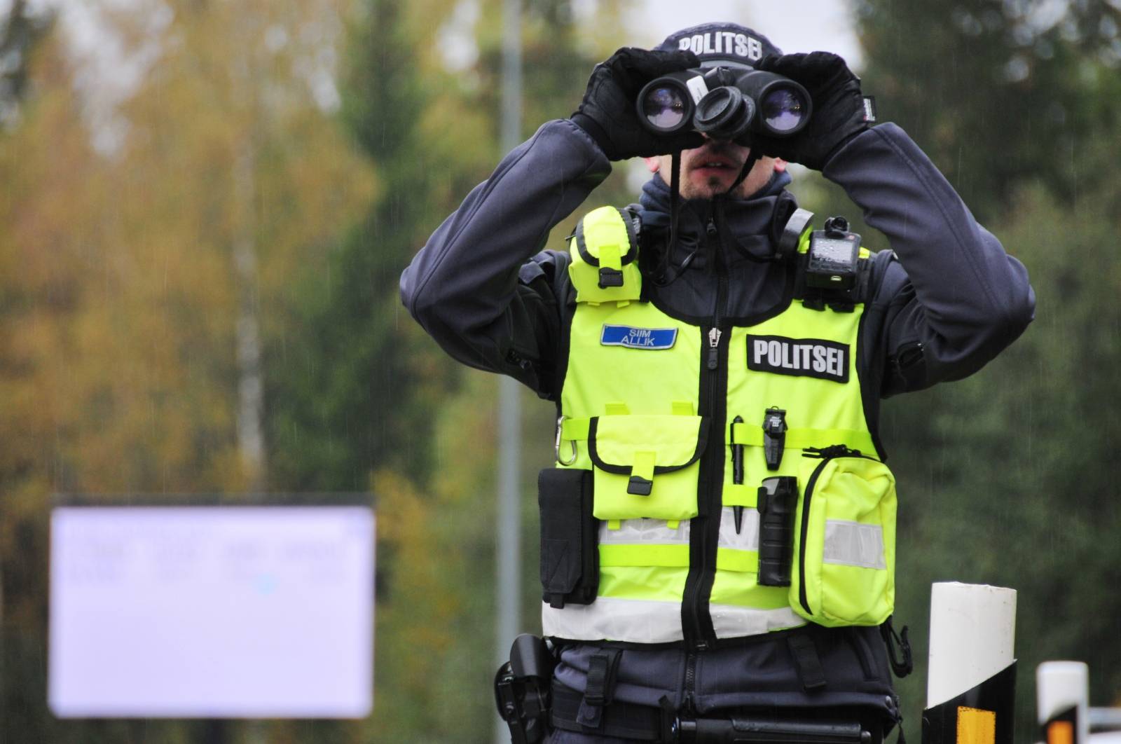 An Estonian police officer looks on near Rapla