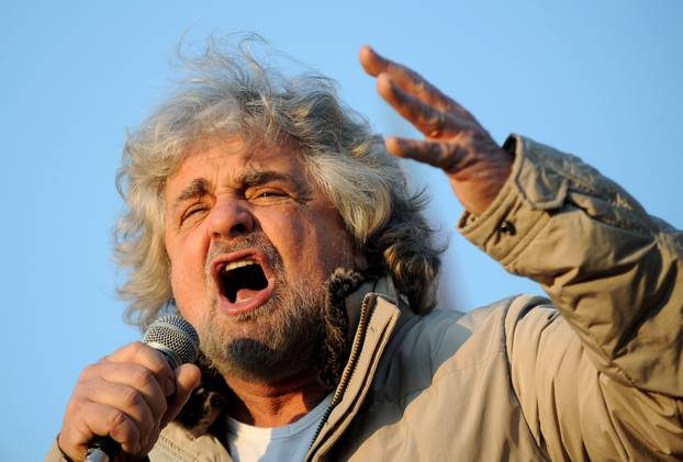 Five Star Movement leader and comedian Beppe Grillo gestures during a rally in Turin