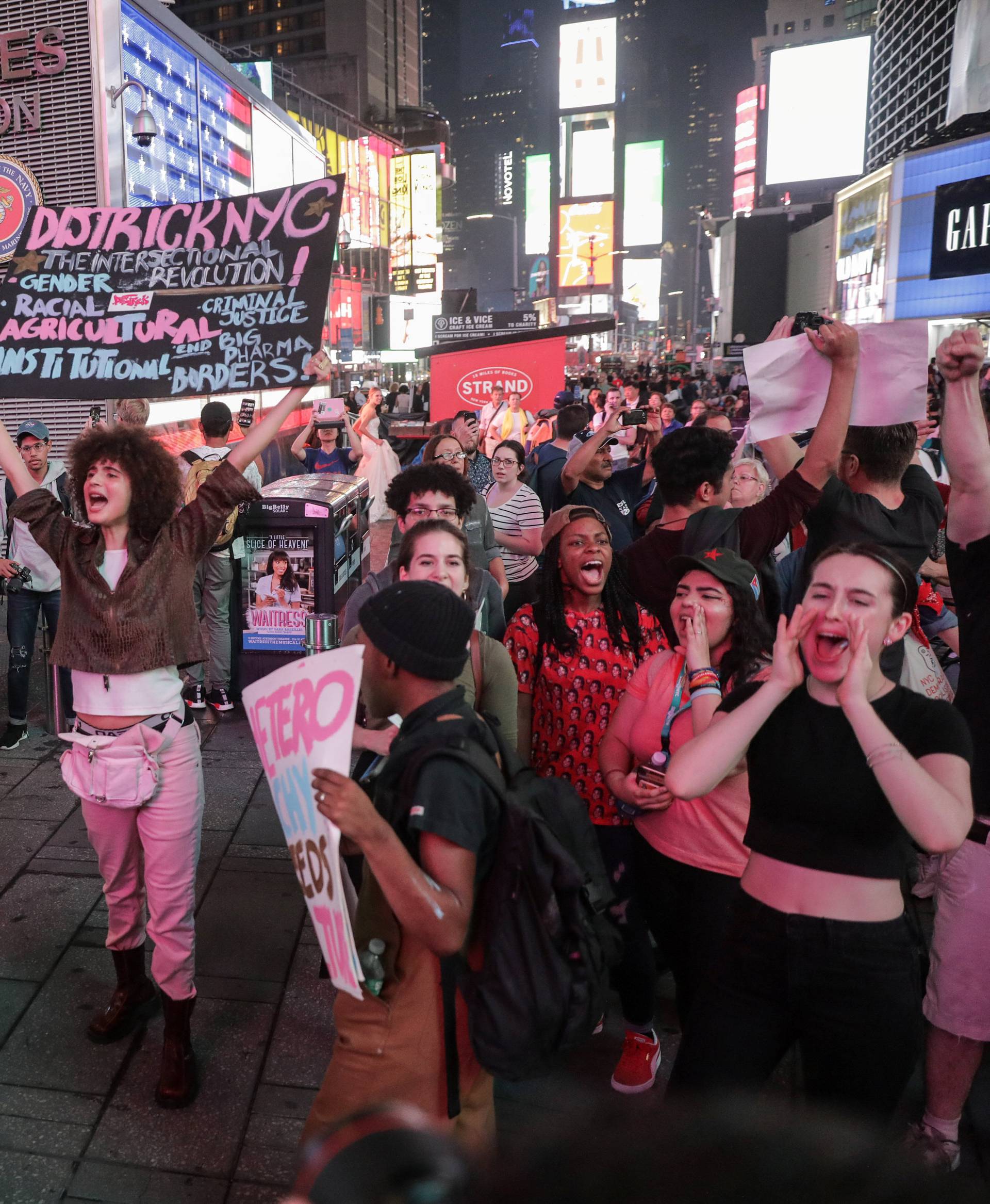 Activists hold a protest and rally in opposition to U.S. Supreme Court nominee Brett Kavanaugh near Times Square in New York