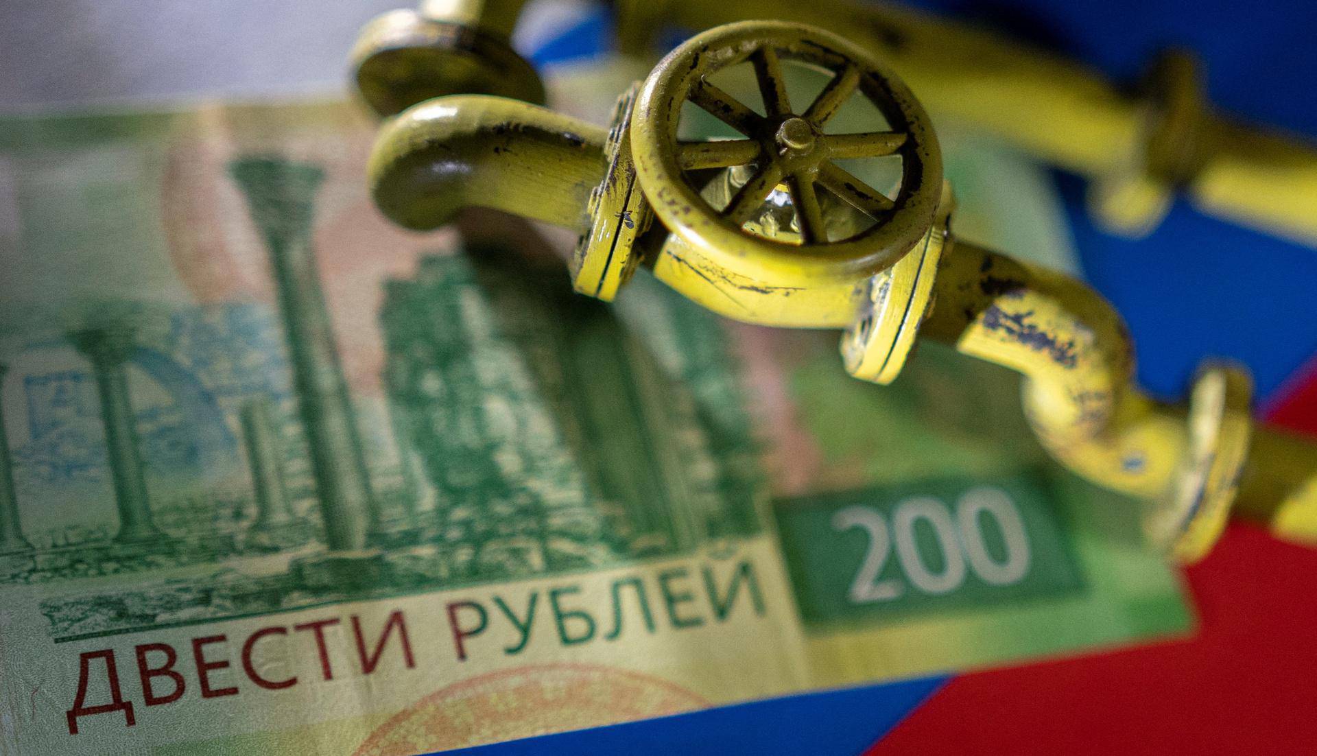 Illustration shows natural gas pipeline, Russian Rouble banknote and flag