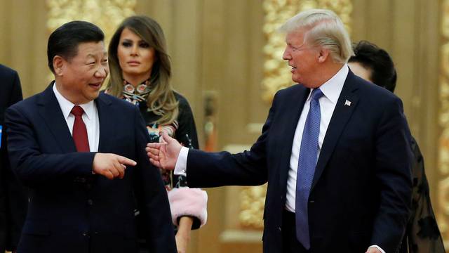FILE PHOTO: U.S. President Donald Trump and China's President Xi Jinping arrive at a state dinner at the Great Hall of the People in Beijing