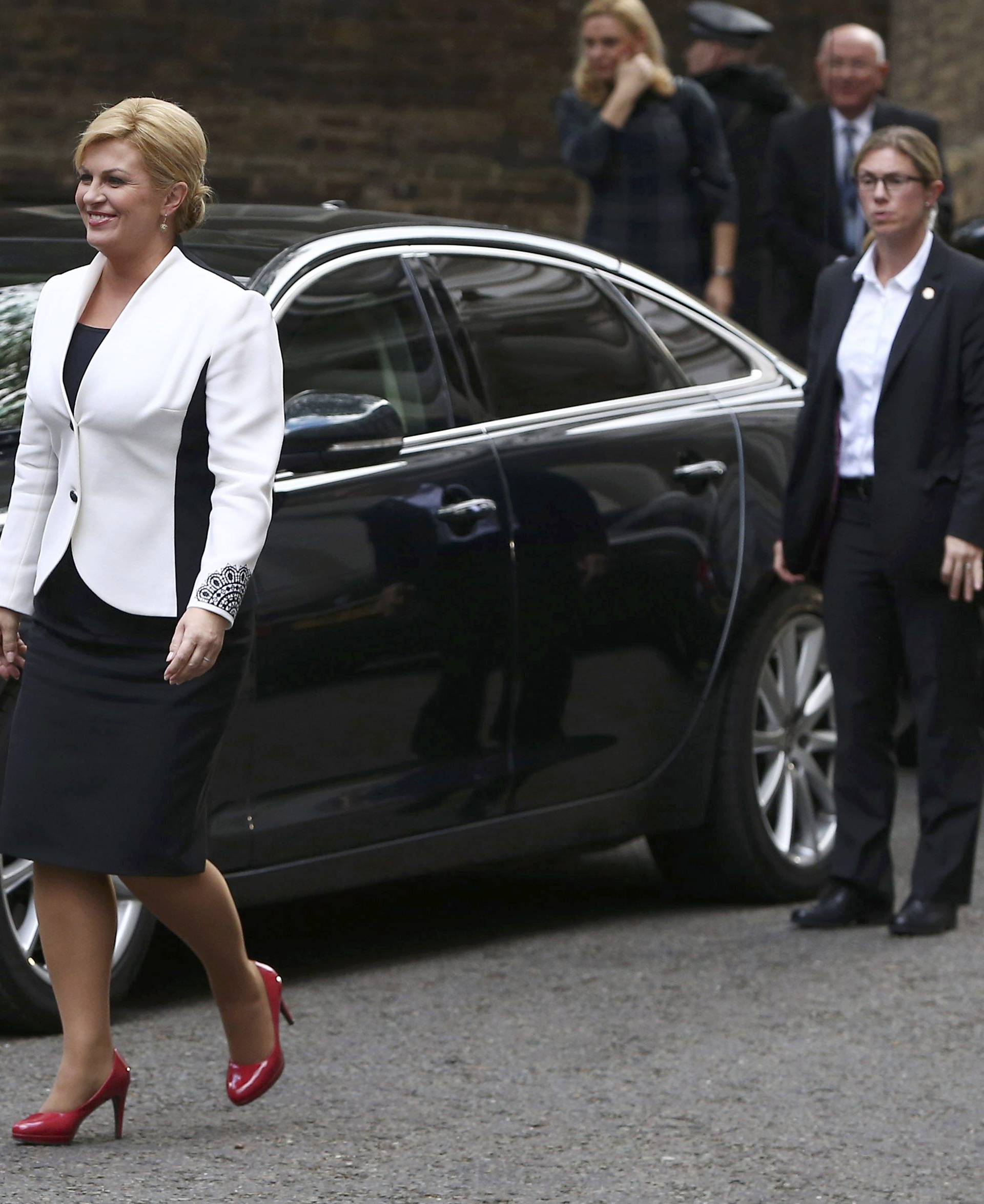 Britain's Prime Minister Theresa May waits to greets Croatia's President Kolinda Grabar-Kitarovic at Downing Street in London