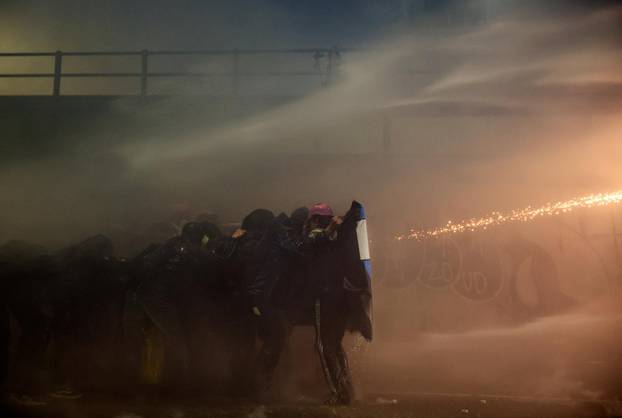 Demonstrators protest the 2026 Winter Olympics in Milan