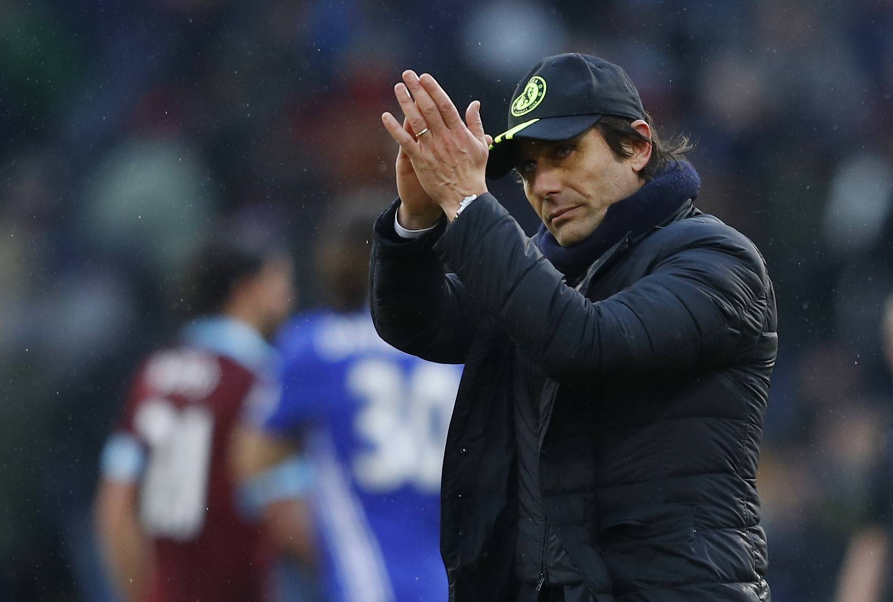 Chelsea manager Antonio Conte applauds fans after the game