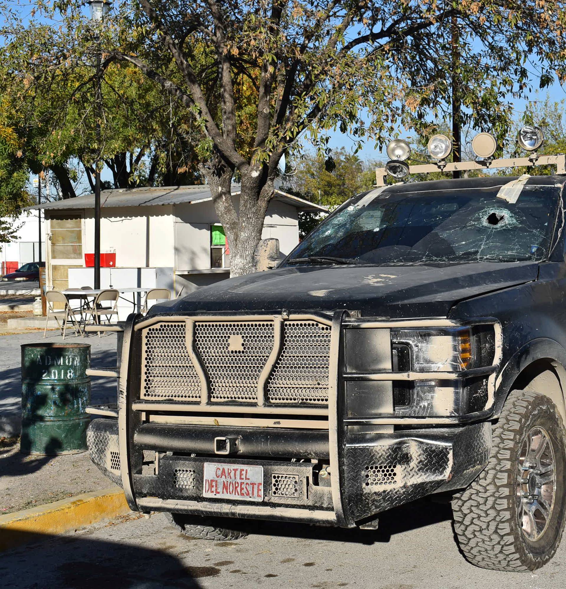A bullet-riddled pick-up truck is pictured after clashes sparked by suspected cartel gunmen in a northern Mexican town that killed 20 people this weekend, in Villa Union, Coahuila