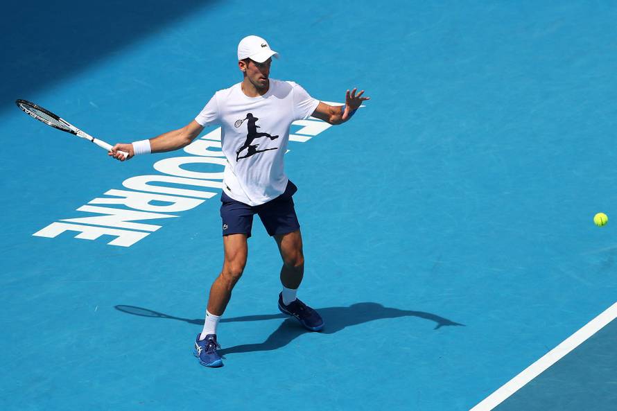 Novak Djokovic practices on court ahead of 2022 Australian Open