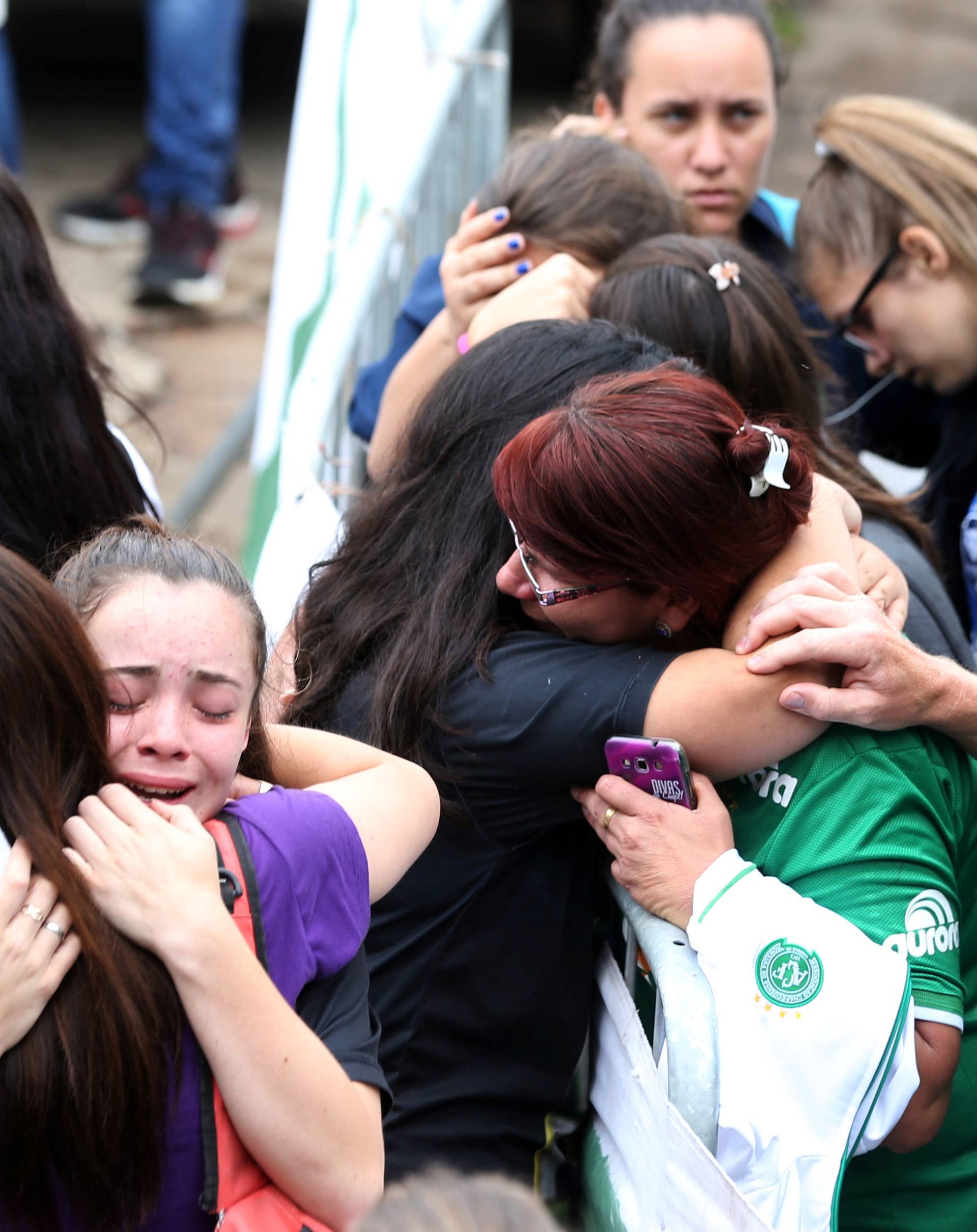 Fans of Chapecoense soccer team react in front of the Arena Conda stadium in Chapeco