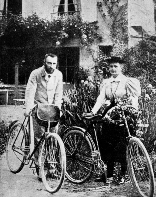 Marie (1867-1934) and Pierre (1859-1906) Curie pictured in their early married life when they enjoyed cycling in the French countryside.