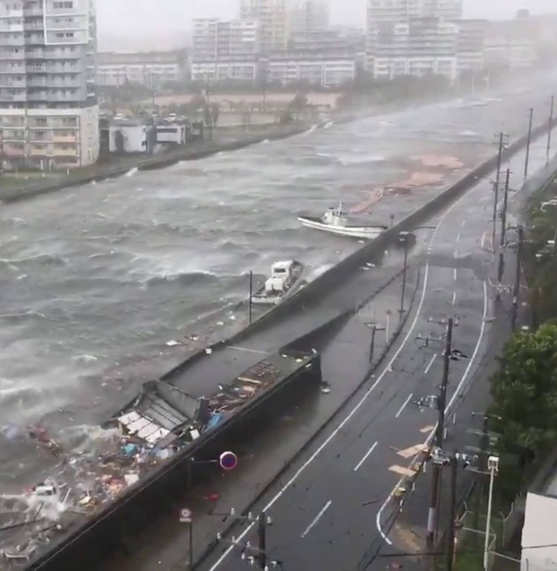 Boats float along with debris during Typhoon Jebi in Nishinomiya City