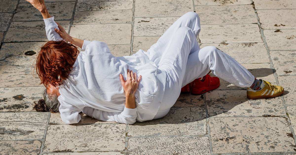 Public Display: Two Women Embrace on the Floor in Split