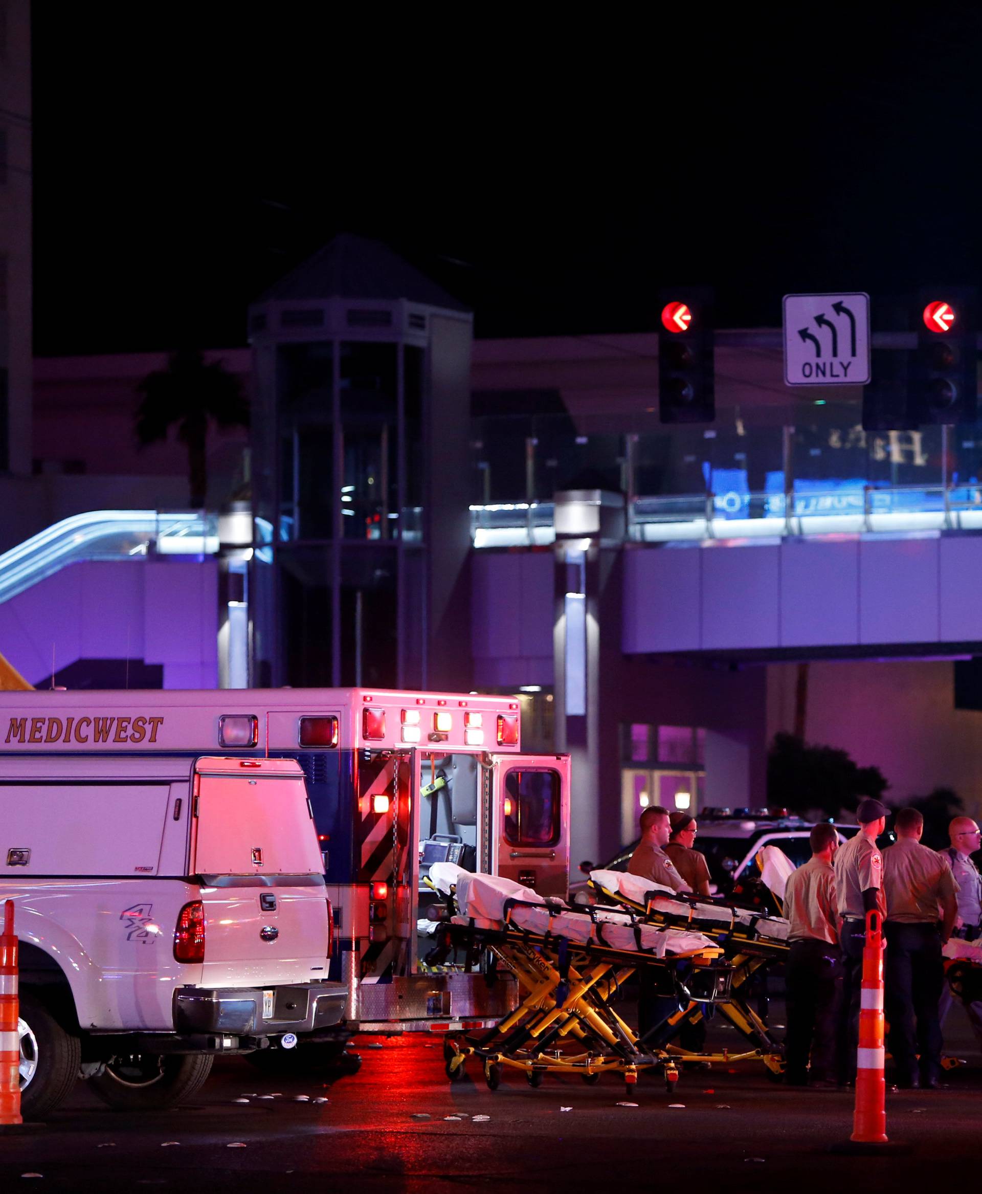 Medical workers stage in the intersection of Tropicana Avenue and Las Vegas Boulevard South after a mass shooting at a music festival on the Las Vegas Strip in Las Vegas