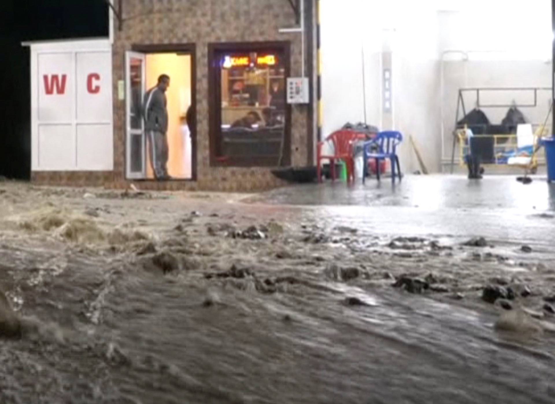 A still image shows a street in a settlement affected by floodwaters in Krasnodar Region